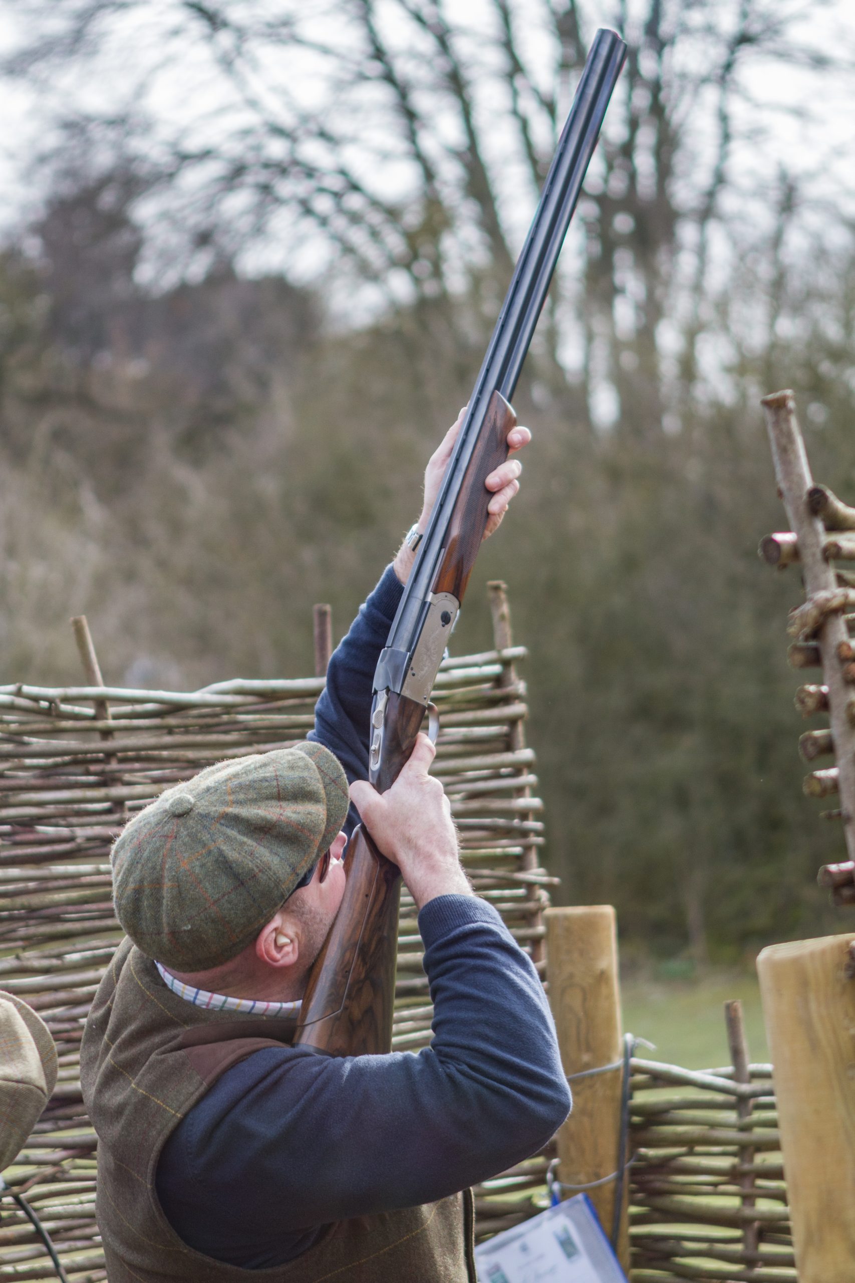 Man shooting in a stand at a shooting ground