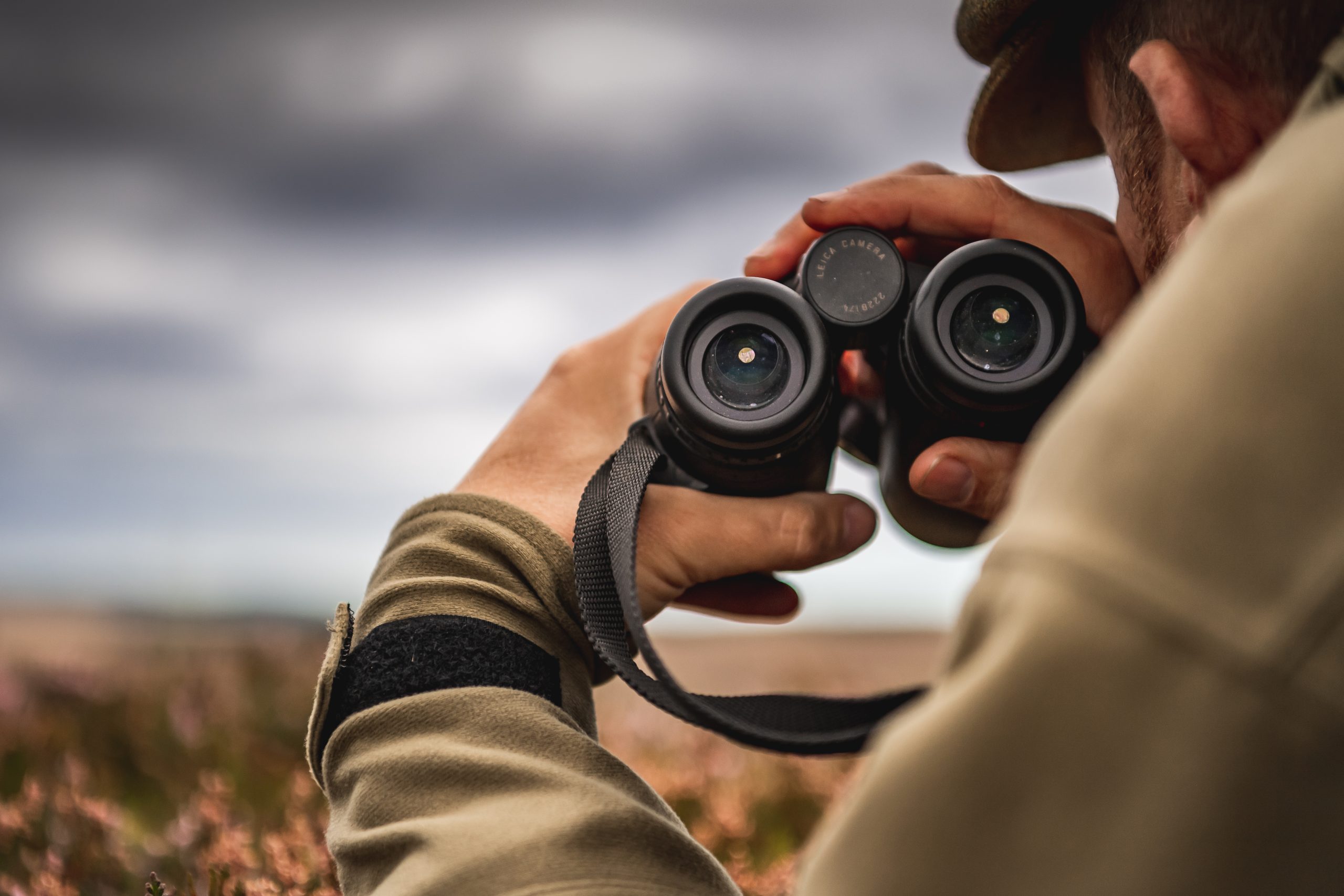 A man holding binoculars