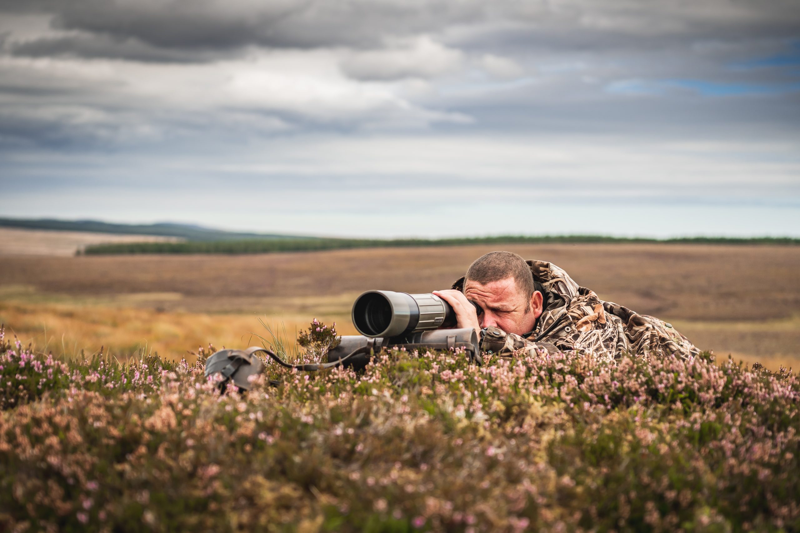 Man with spotting scope