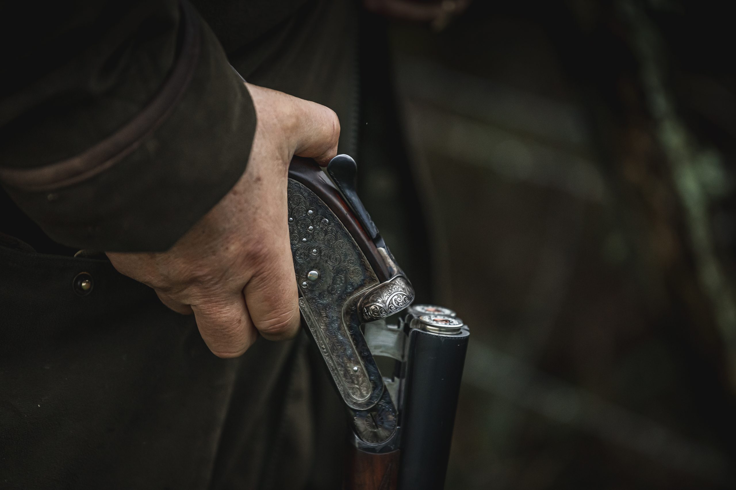 A gun broken with cartridges in the chamber