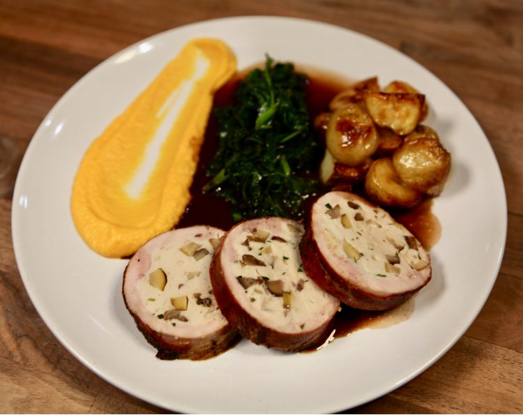 Pheasant ballotine with kale, mini roast potatoes and butternut squash puree