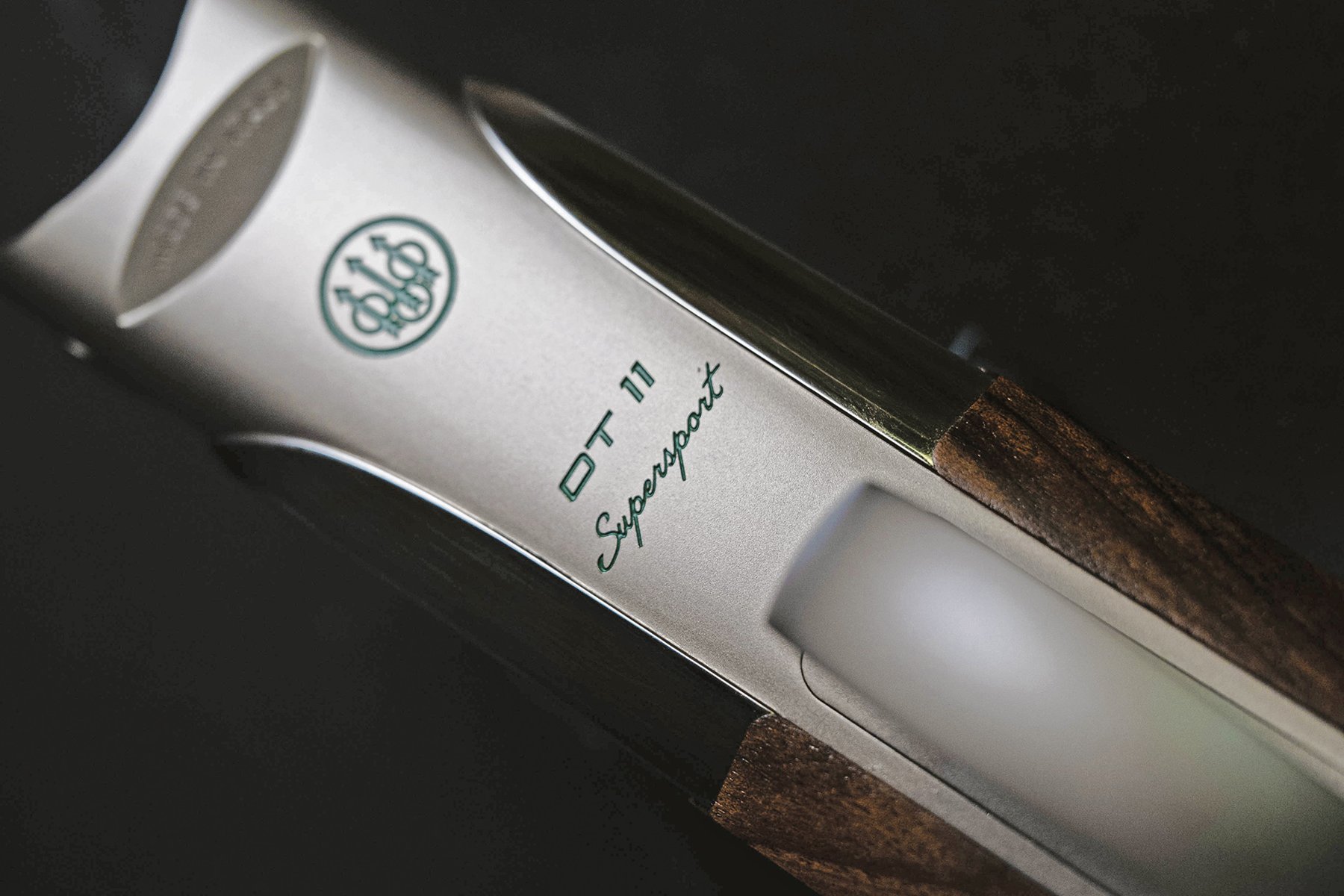 Close-up of the Beretta DT11 Supersport action showing the green italic Supersport script and Beretta logo