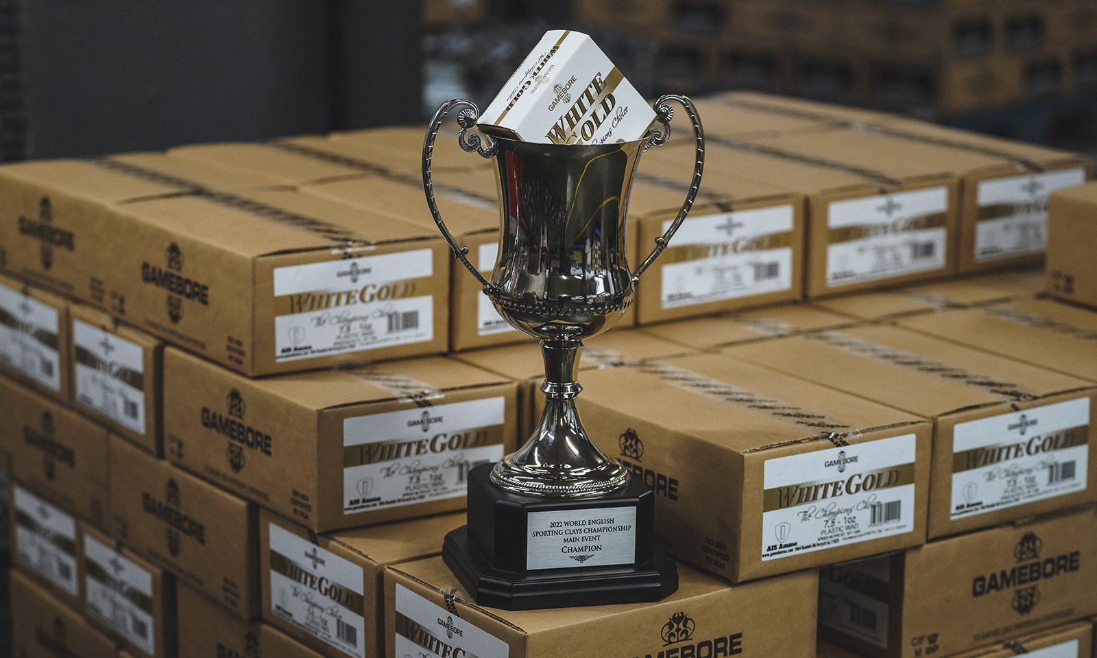 World championship trophy displayed on boxes of Gamebore White Gold cartridges