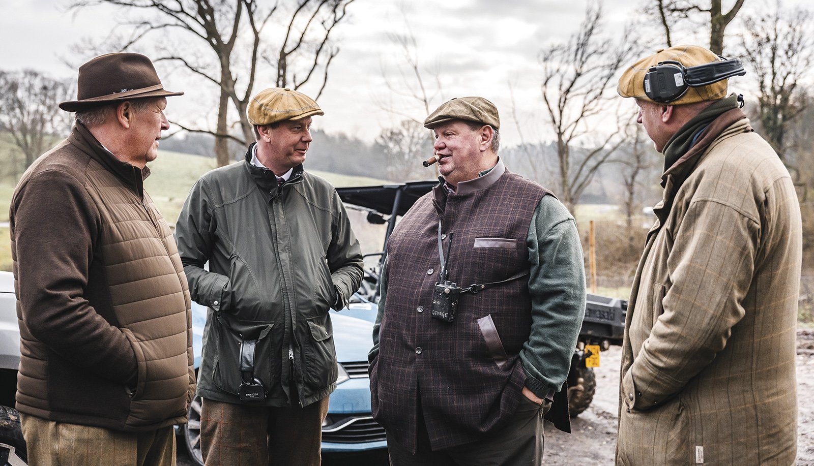George Digweed chatting with fellow shooters outdoors at a country shoot