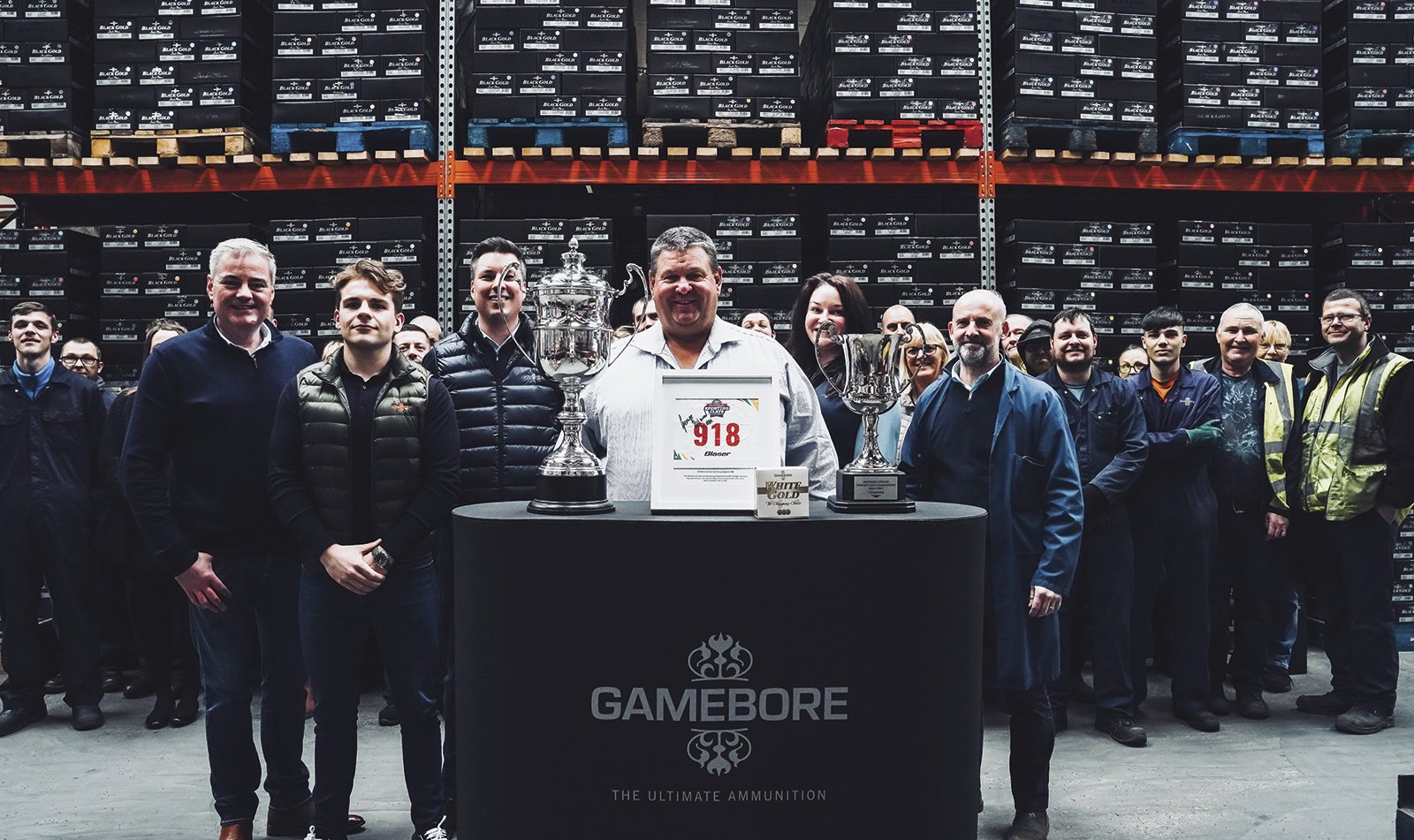 George Digweed with the Gamebore team at their factory, trophies on the table in front of them