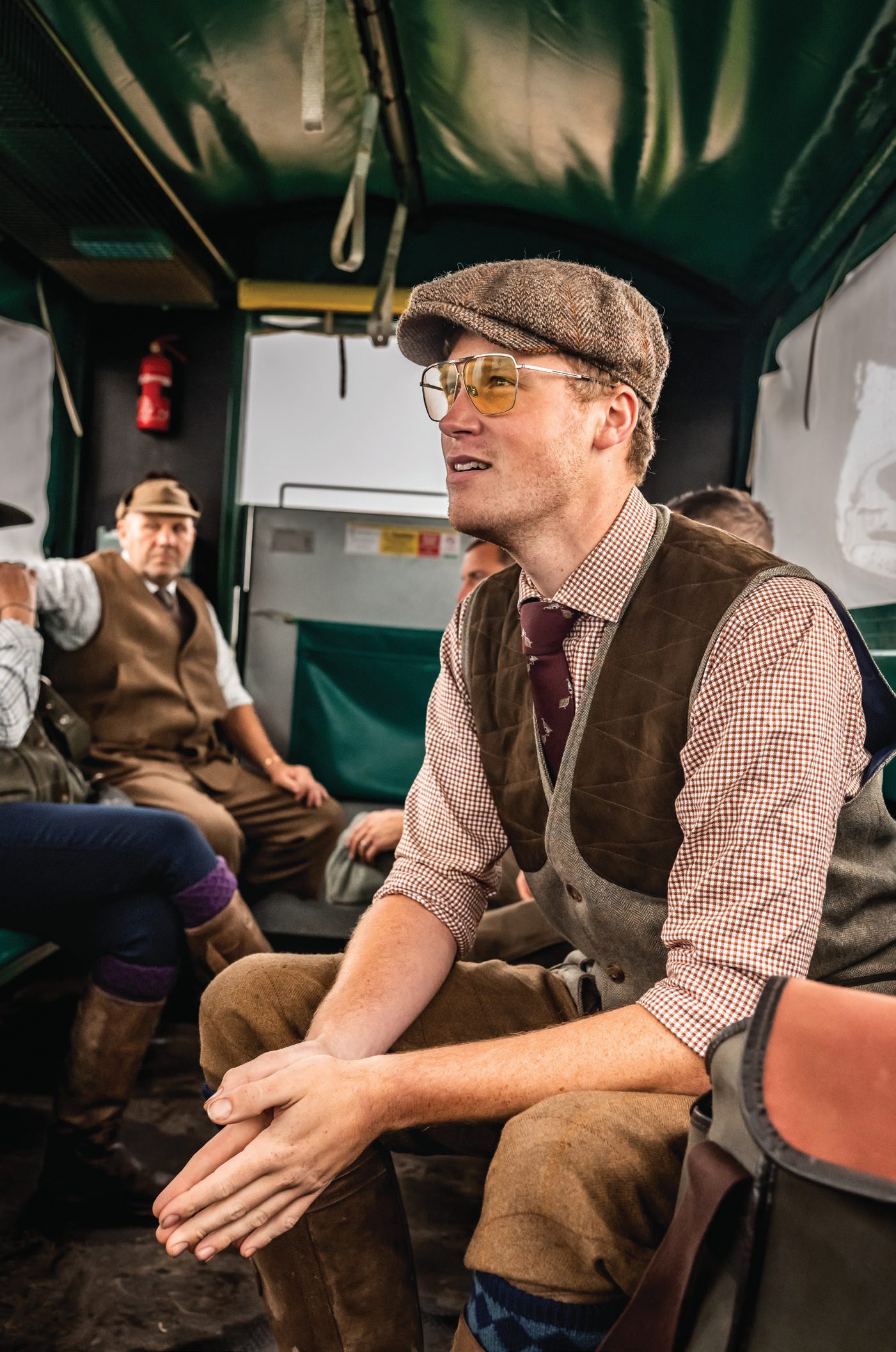 Jonny Carter chatting with other guns in the shoot bus between drives