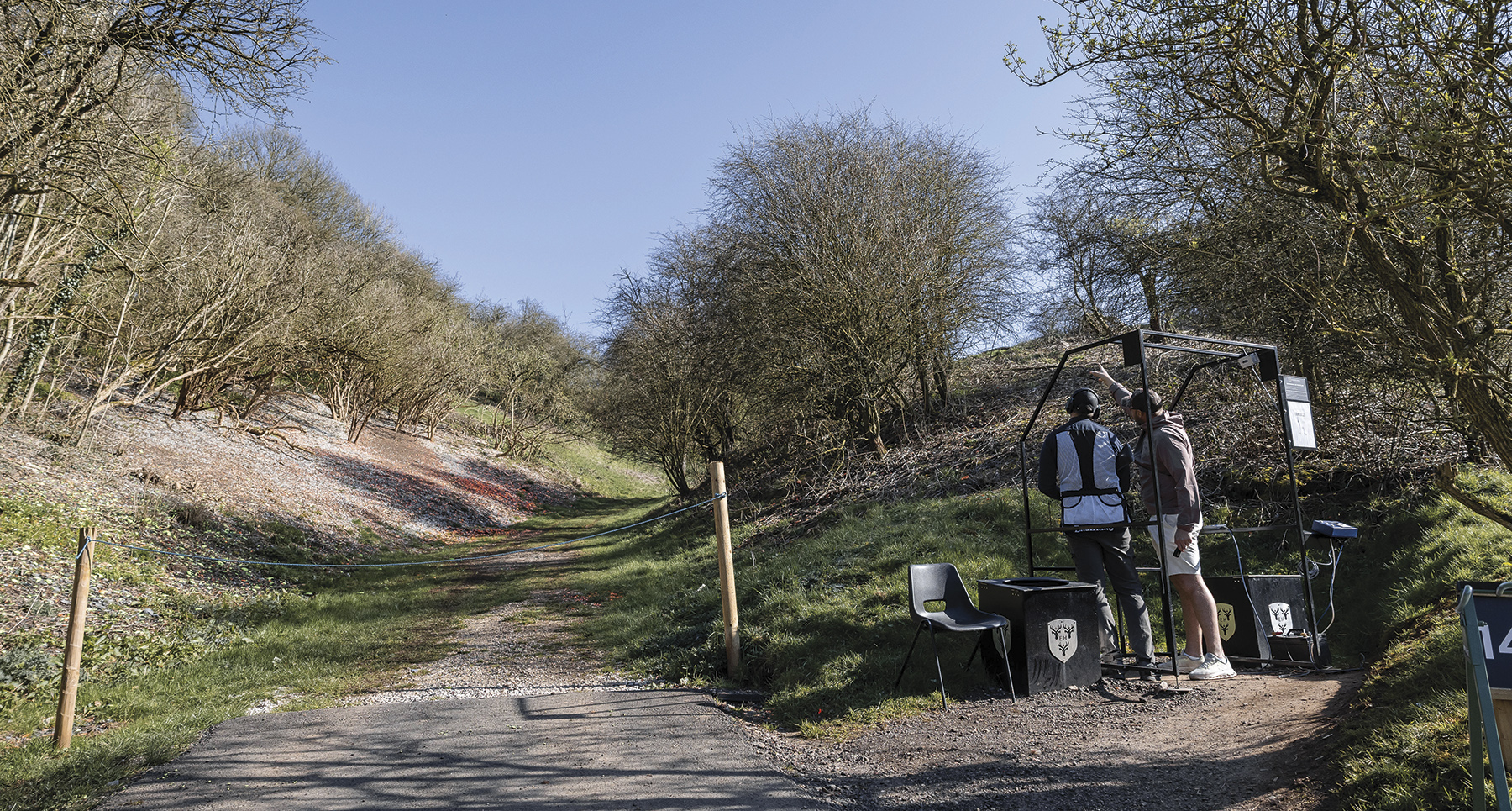 Broken clay targets scattered across the hillside at Eaton Hall sporting clays ground